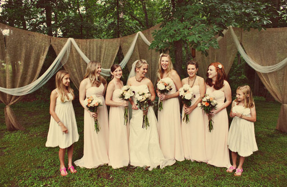 Gorgeous to see soft dresses against the texture of a neutral burlap curtain