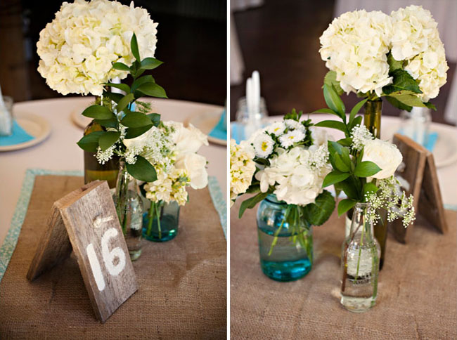 We love the rustic wood table numbers too