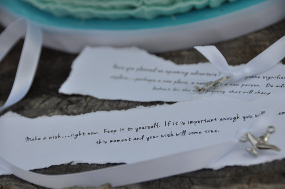 Written messages for each charms for a wedding cake pull 