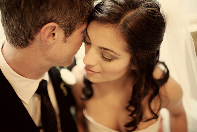 close up photo of intimate moment with bride and groom