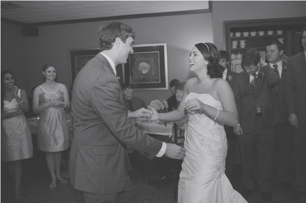 black and white photo of bride and groom dancing