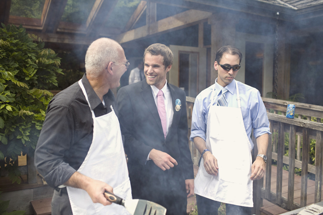 wedding guys at the grill with aprons