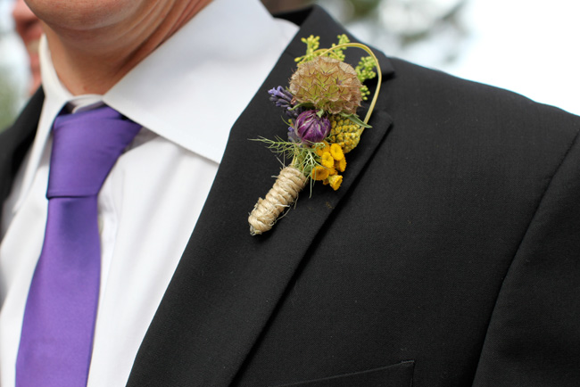 groom's purple tie and unique boutonniere