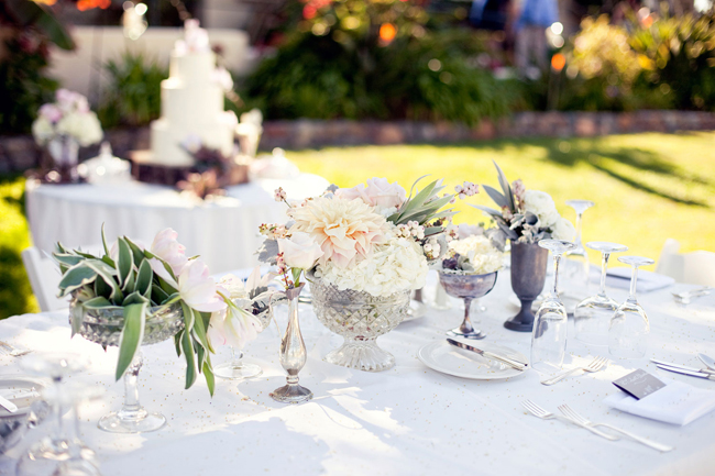 vintage centerpieces with flowers in shades of ivory, blush and grey