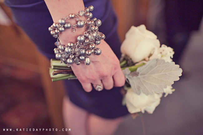 bridesmaid jewelry and holding white roses