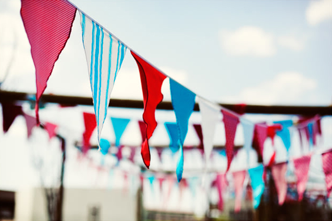 red white and blue pennants at stylish south african wedding