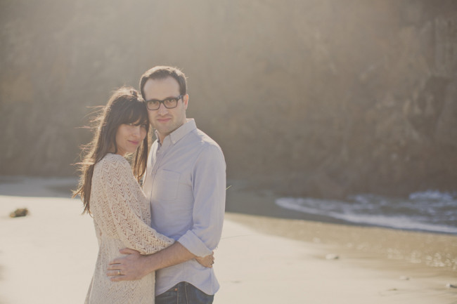 couple embraces on Pfeiffer Beach after elopement wedding ceremony