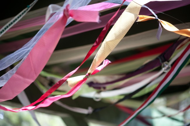 colorful streamers hang at food truck wedding