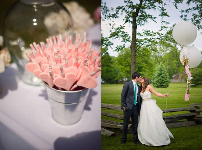 pink hearts on straws; bride and groom kiss holding geronimo balloons