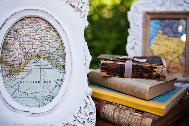 vintage books and maps in frames 