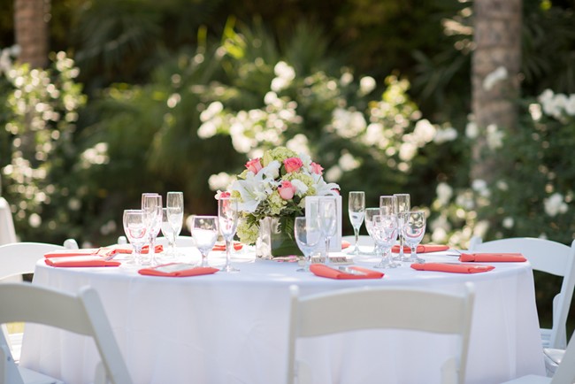 wedding reception table with pink napkins