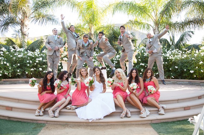 bride and groom with bridal party wearing grey and coral colors