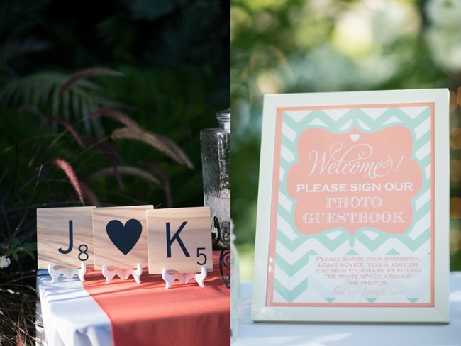 Scrabble pieces sign with bride and groom initials and blue and pink sign for guest book 