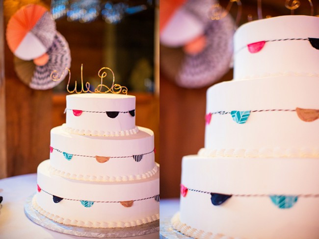 White wedding cake with paper decor