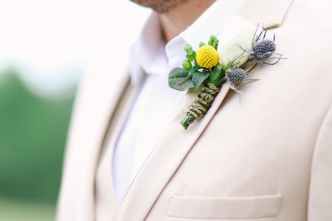 12 Groom with yellow and purple boutoniere at Lindsey Plantation in Greer SC wedding