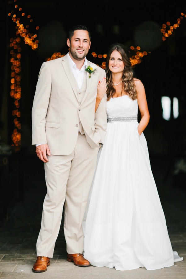 16 Bride and groom standing inside bard at Lindsey Plantation in Greer SC wedding