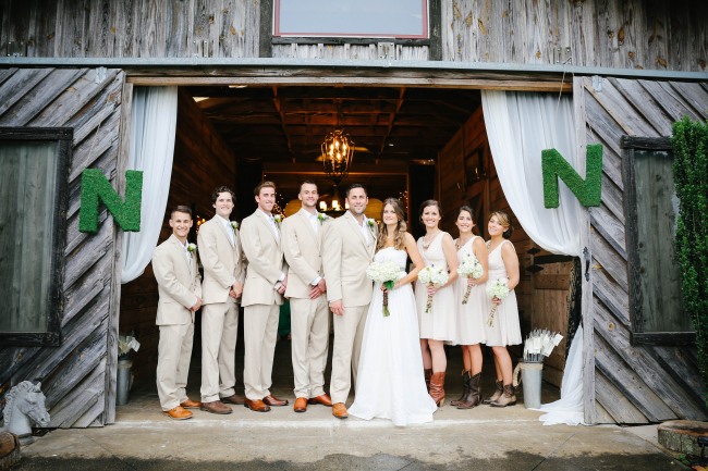 29 Bridal party in cream and white standing in door way at Lindsey Plantation in Greer SC wedding