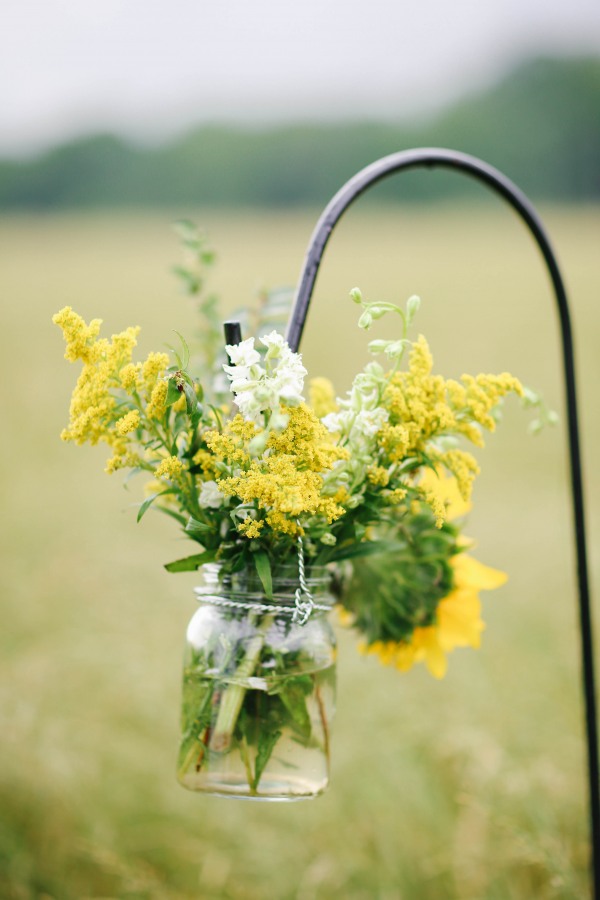 35 Aisle decor mason jar with yellow green and white flowers at Lindsey Plantation in Greer SC wedding ceremony