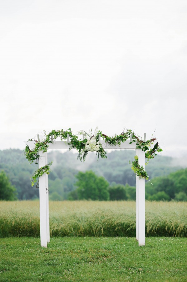 37 white wedding altar with greenery at Lindsey Plantation in Greer SC outdoor wedding