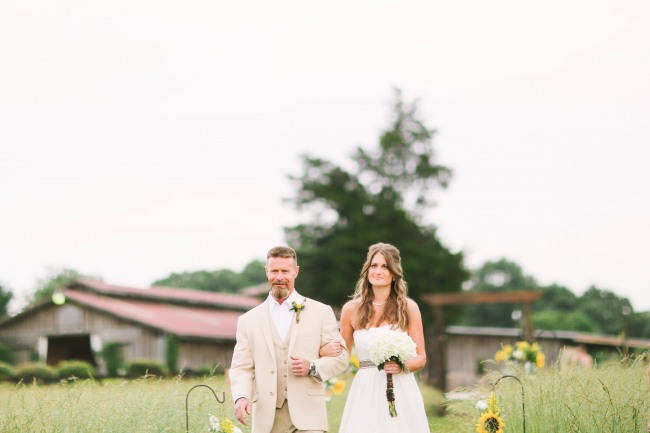 41 bride wearing j crew dress walking down aisle with ther father at Lindsey Plantation in Greer SC wedding