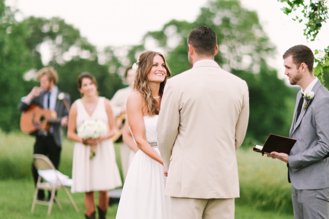 43 Bride and groom during outdoor ceremony at  Lindsey Plantation in Greer SC holding hands