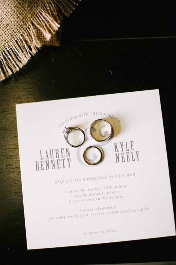 6 Minted wedding invitation and wedidng bands on top at Lindsey Plantation in Greer SC swedding