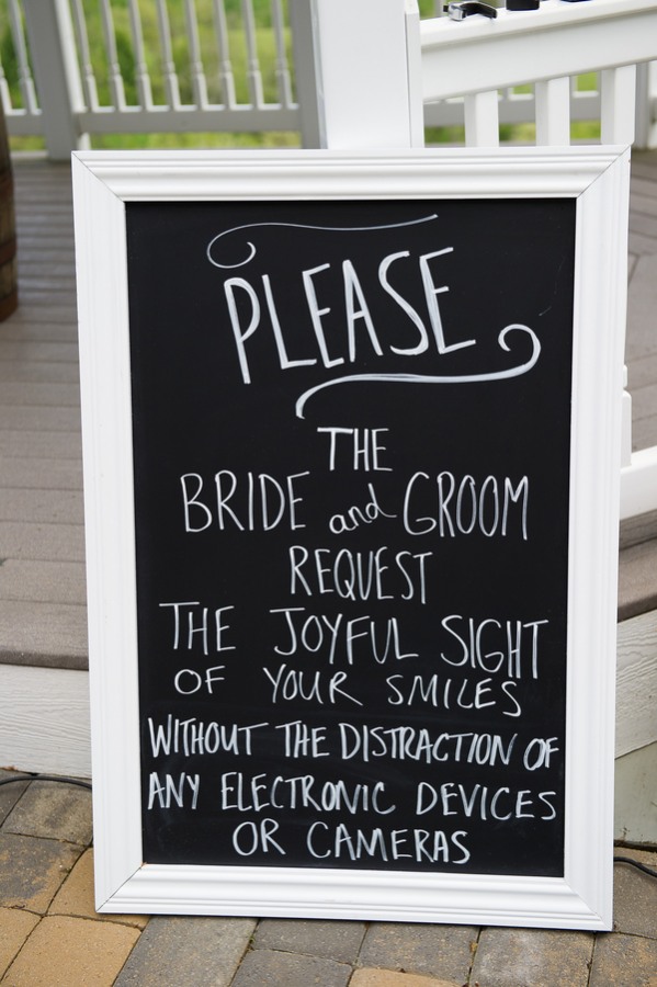 Chalkboard sign requesting guests to turn off electronic devices