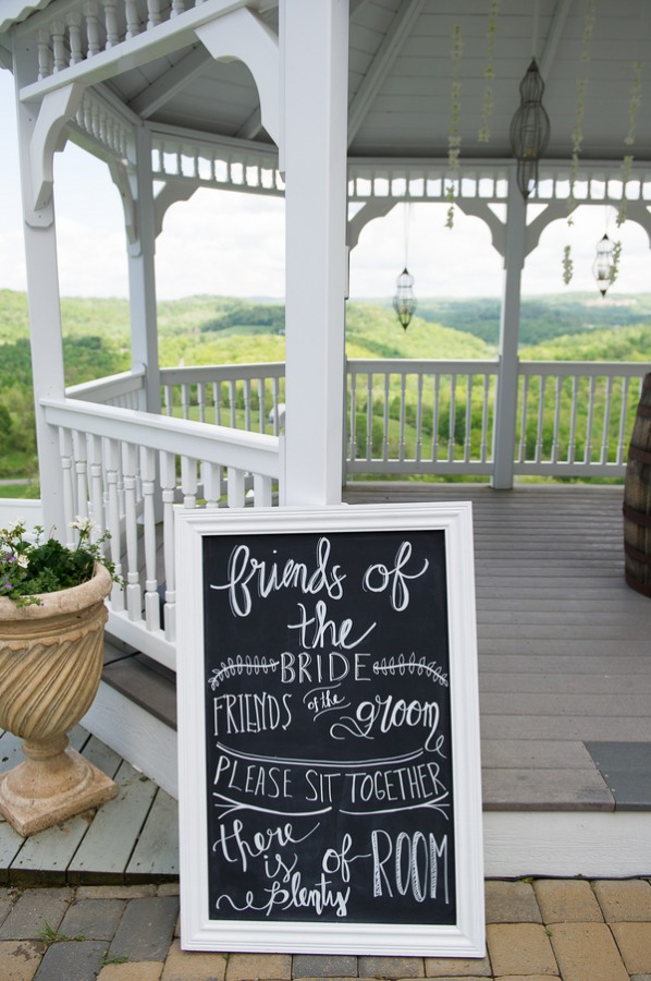 chalkboard sign against white gazebo at Benton Grove