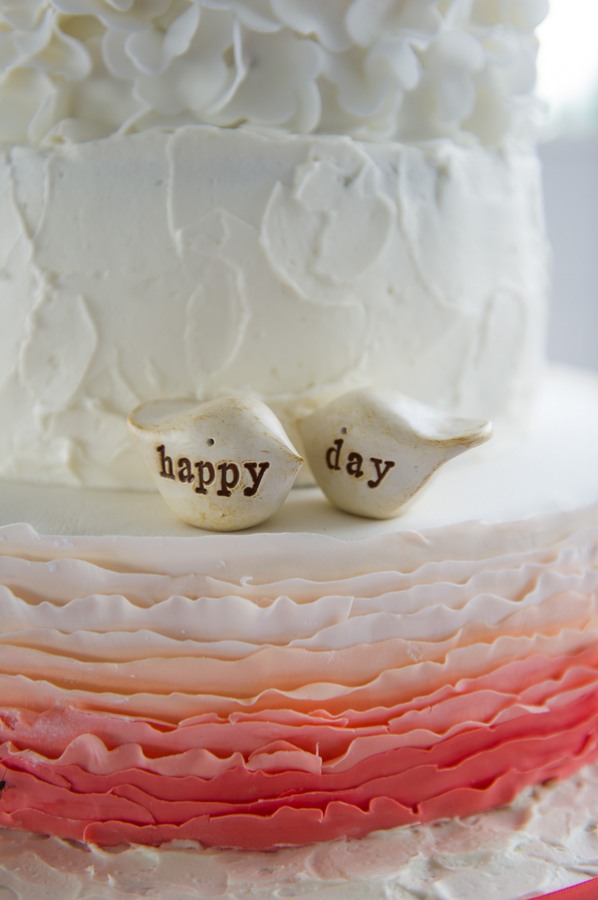 figurines on white wedding cake
