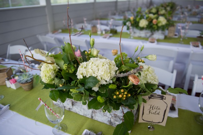 white hydrangea centerpiece on lime green table runner