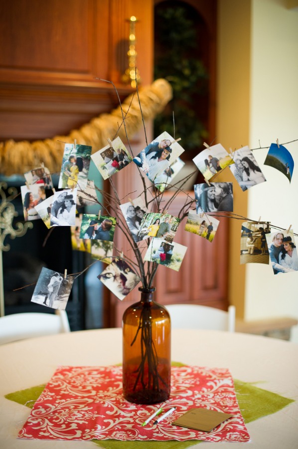 photos on tree branches in bottle