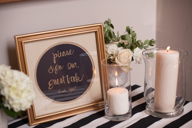 17 wedding guest book table with gold frame and white candles