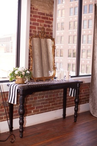 DIY wedding at Aubrey Hall reception table with gold mirror and black and white striped table runner