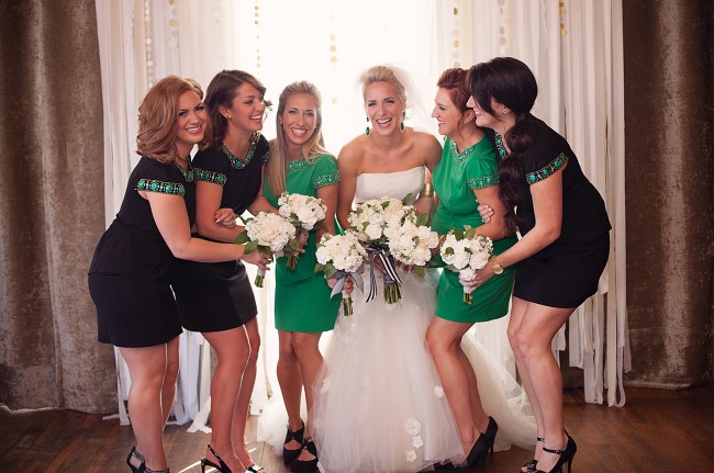 21 bride with bridesmaids in black and green
