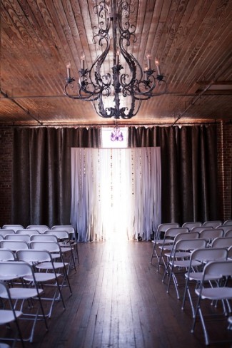 7 wedding ceremony with chairs and black rod iron chandalier