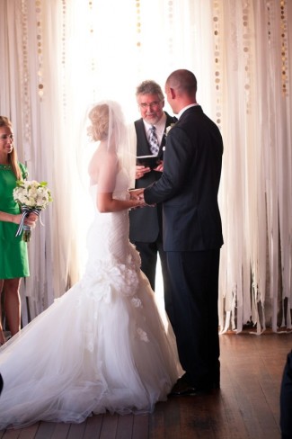 Bride and groom saying vow up at alter