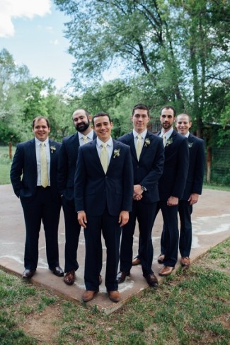groom with groomsmen wearing yellow ties