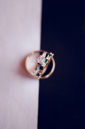 princess cut engagement ring with baggets and emerald green