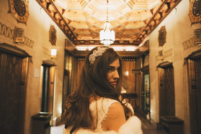bride wearing rhinestone head piece walking down the hall of elevators at the Pittsfield Building 