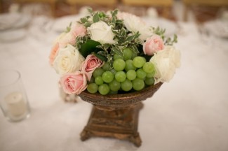 pink and white roses with green grapes for wedding receoption center piece