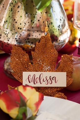 Gold maple leaf name tag holder for a dinner party 