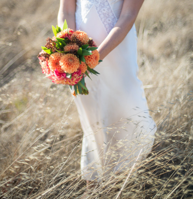 close up photo of bridal bouquet with peach honeycomb dahlias