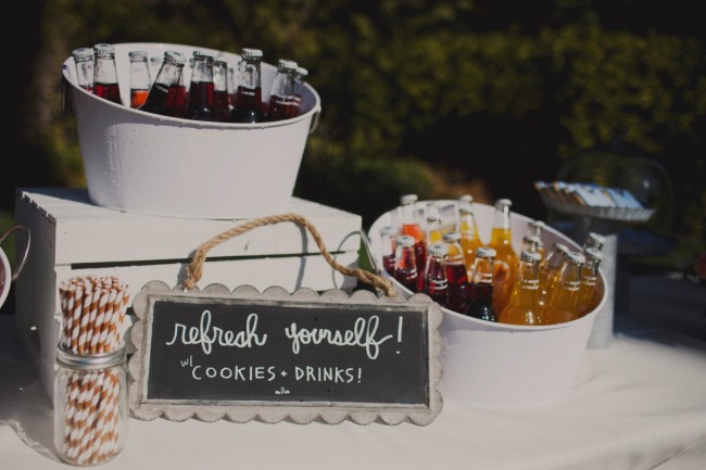 Wedding reception chalkboard sign with "refresh yourself! w/ cookies and drinks!"
