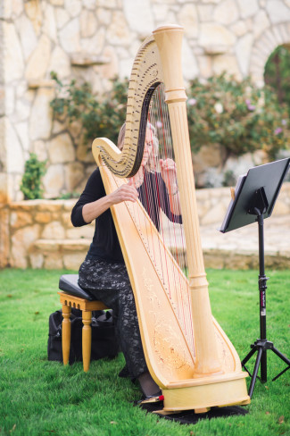 Old World Spanish Style Wedding At Rancho Mirando Harpist Playing During Outdoor Wedding Ceremony At Rancho Mirando