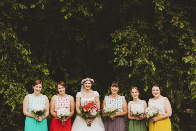 Bride with bridesmaids wearing bright pantone colored mismatched dresses