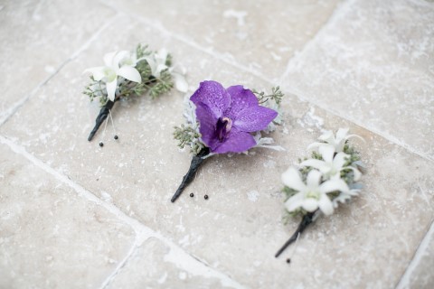 Purple and white boutonnieres 