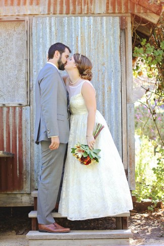 Bride and groom kissing at See Canyon Fruit Ranch captured by Alison D Photography