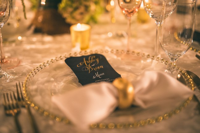Gold and clear glass place setting with Wedding Paper Divas reception menu