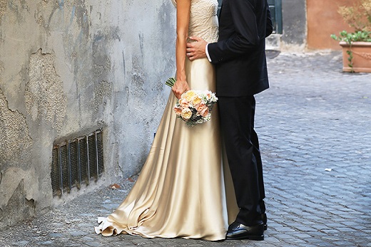 Bride-wearing-a-silk-dress-standing-with-groom-in-the-streets-of-italy1