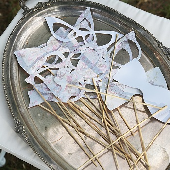 Silver tray of Wedding photobooth accessories created by Avorio paper
